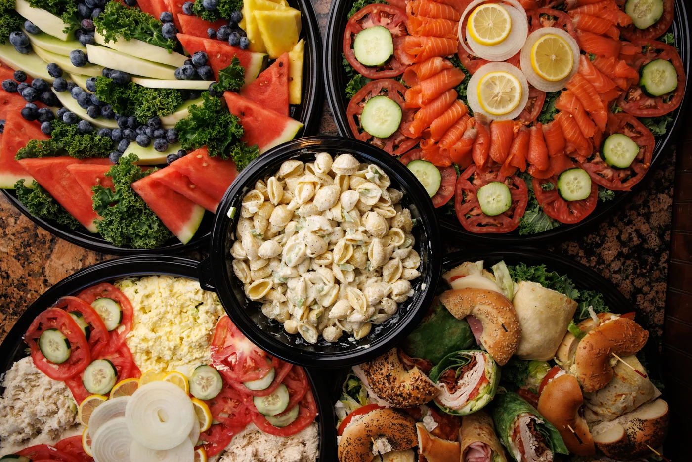 A Bagel Boyz catering spread with bagels, sandwiches, and accompaniments
