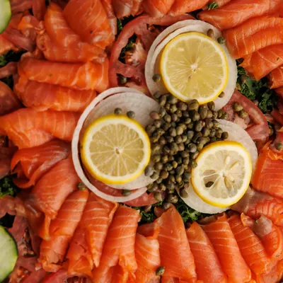 Smoked nova platter with lemon, onion, capers, tomato and cucumber